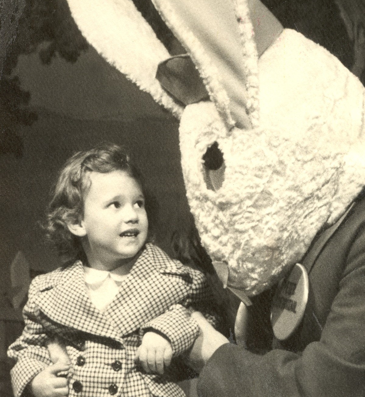 Show Me Detroit Tours owner, Pat Haller, is shown as a child sizing up the Easter Bunny at the iconic (and long-gone) J.L. Hudson Department Store.  