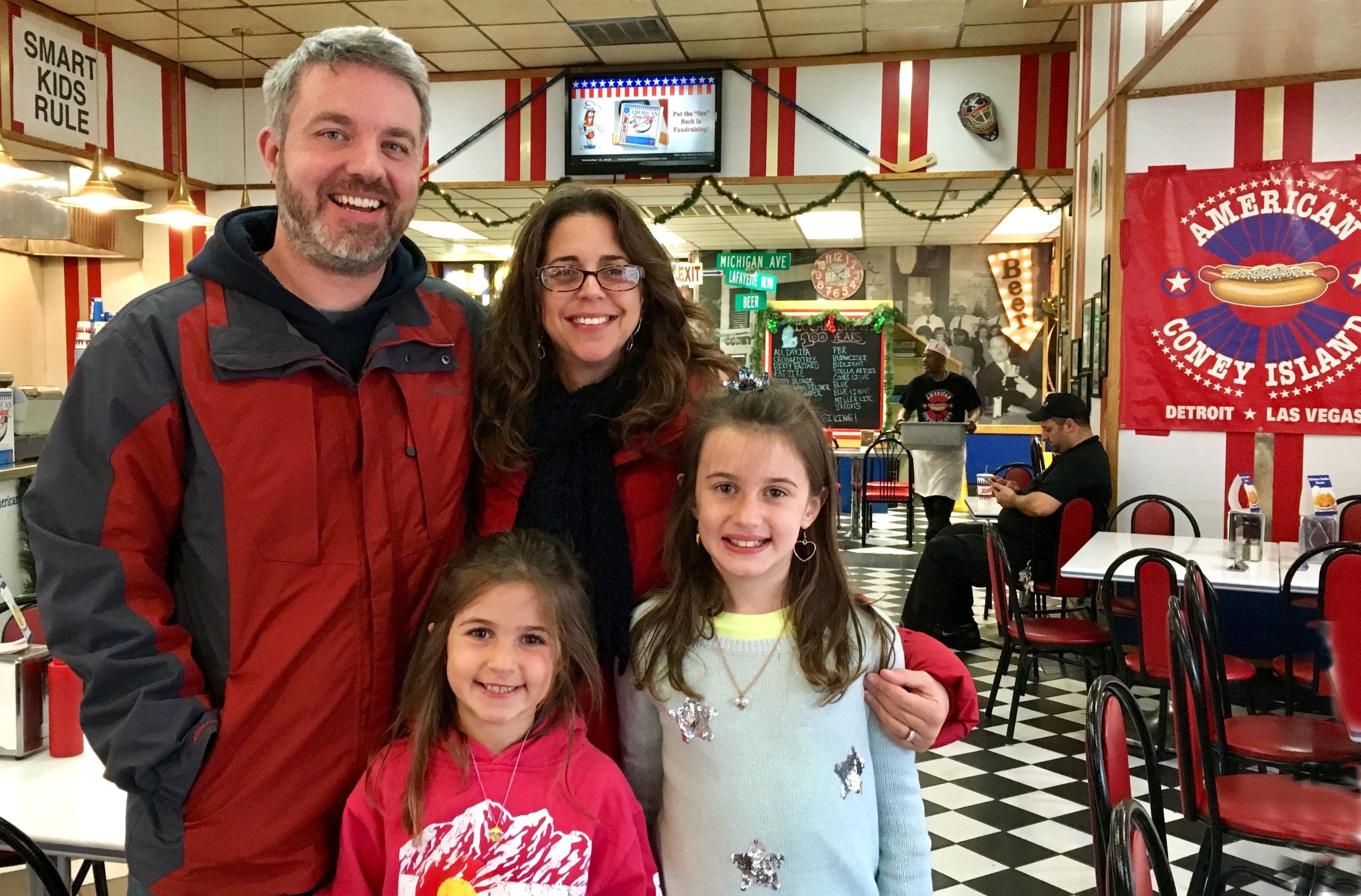 Family is visiting the American Coney Island restaurant in Downtown Detroit.