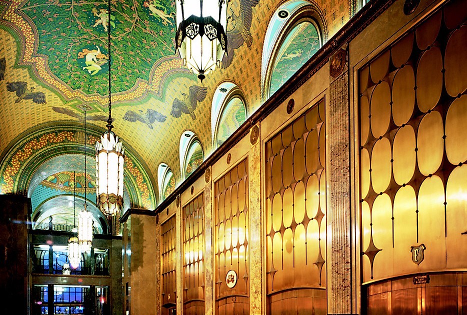 The elegant art deco lobby of Detroit's historic Fisher Building is shown, including the entrance to the Fisher Theatre.
